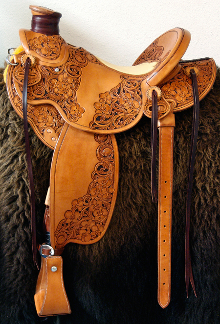 Cowgirl Cate light weight Wade with Orchid Floral tooling.  Contact us about a saddle made just for you like this one.